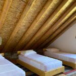 single beds on the rooms of vila Ramaj